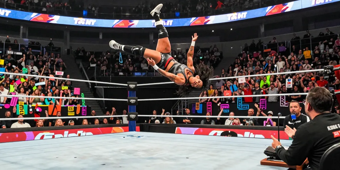 Roxanne Perez performing an aerial maneuver in a thrilling wrestling match, showcasing athleticism and fan engagement.